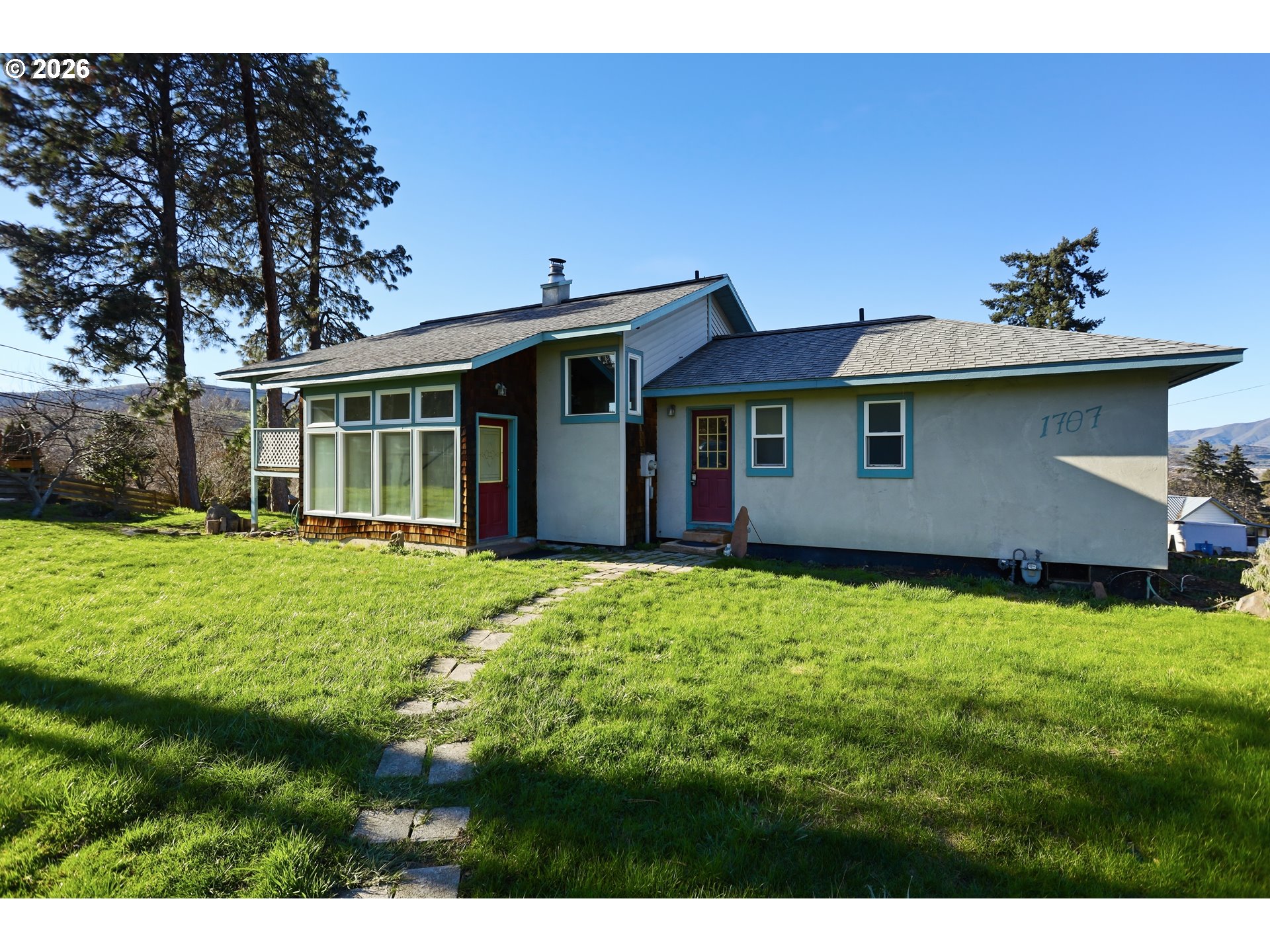 1707 Bridge Street The Dalles, OR 97058 - Photo 1 of 41 a view of a house with yard and sitting area