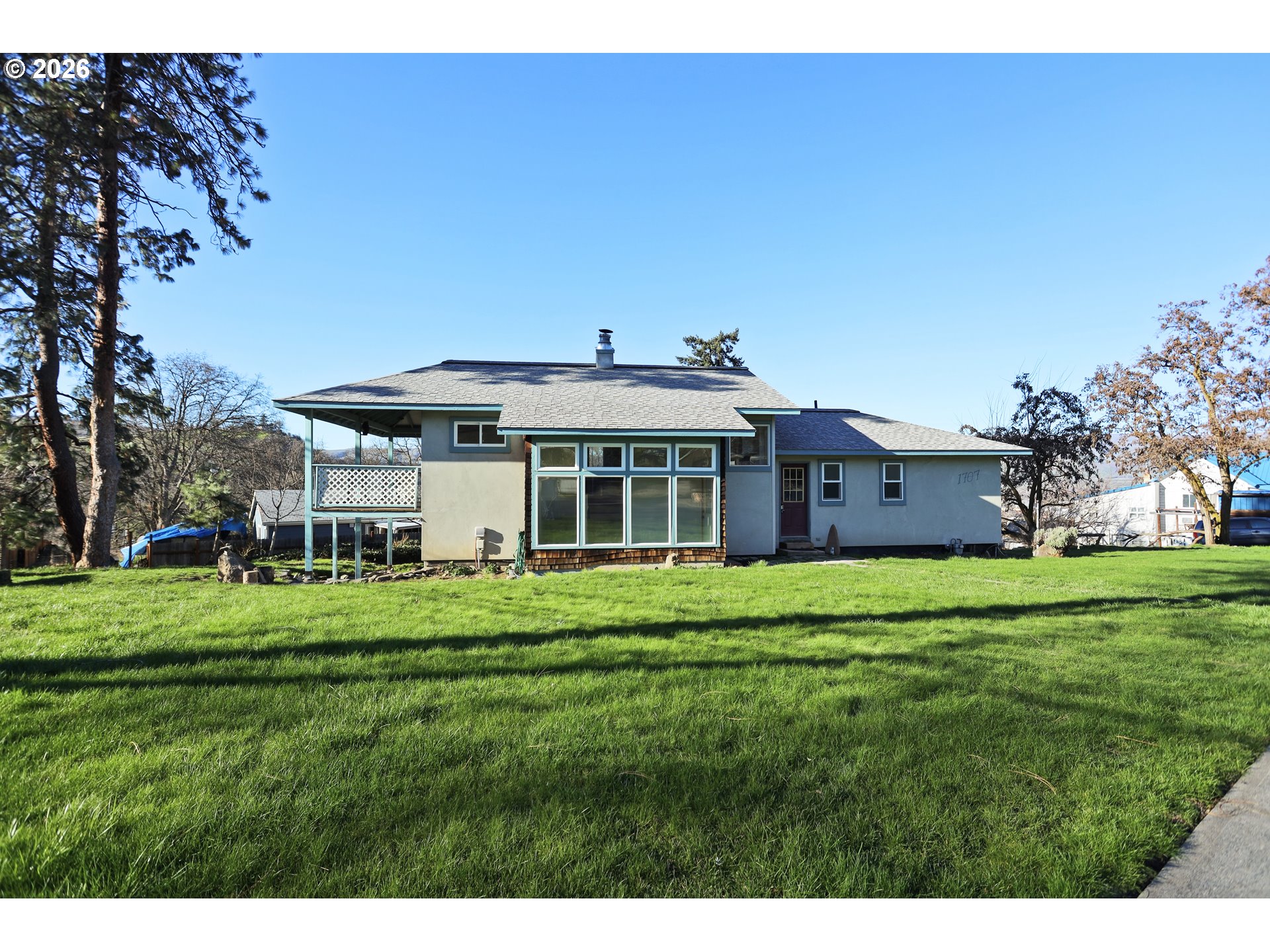 1707 Bridge Street The Dalles, OR 97058 - Photo 2 of 41 a front view of a house with a garden