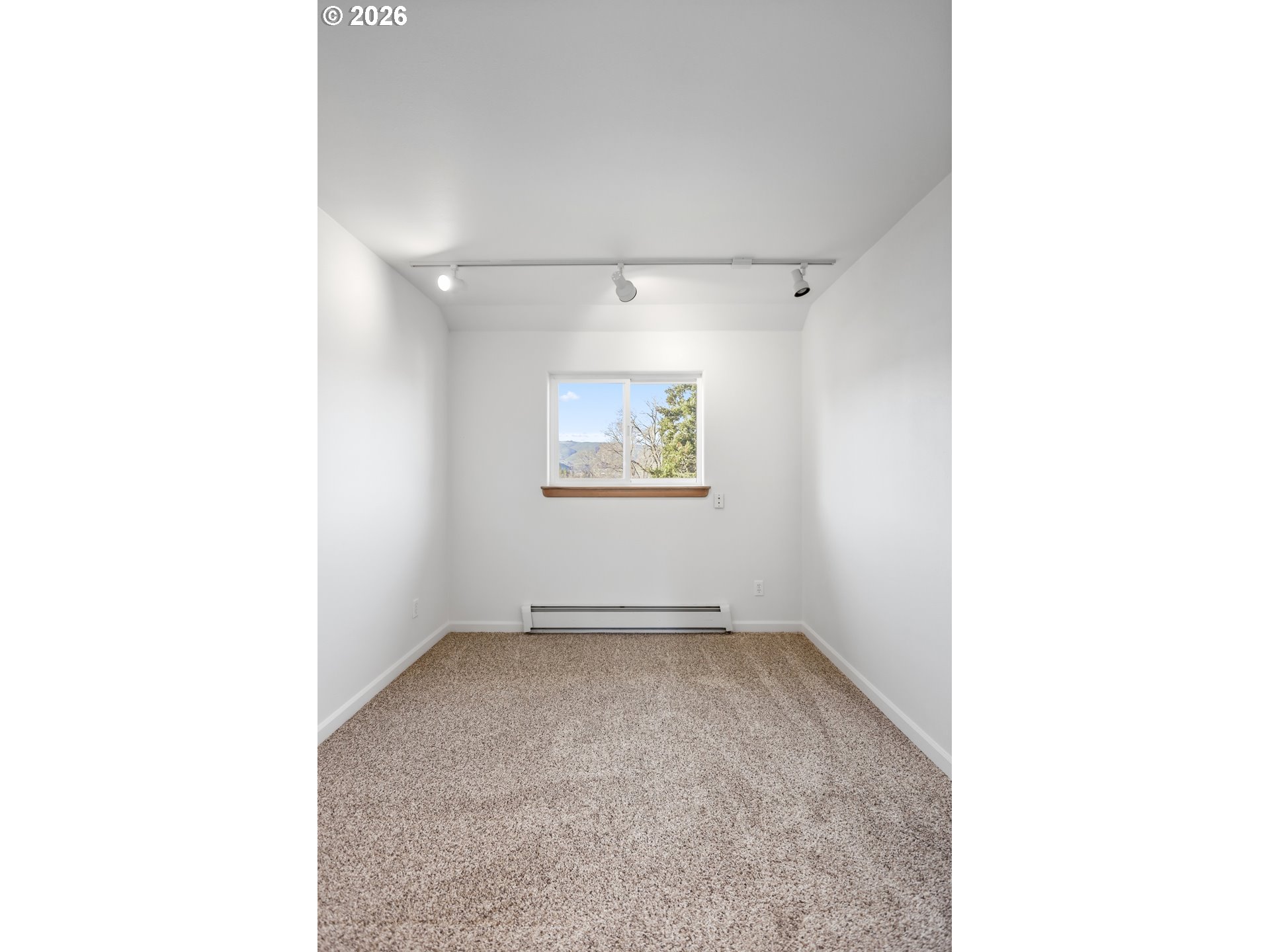 1707 Bridge Street The Dalles, OR 97058 - Photo 22 of 41 a view of an empty room with a window