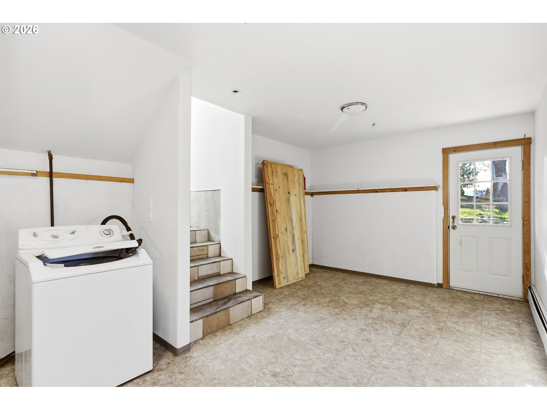 1707 Bridge Street The Dalles, OR 97058 - Photo 26 of 41 a view of a kitchen with fridge and wooden floor