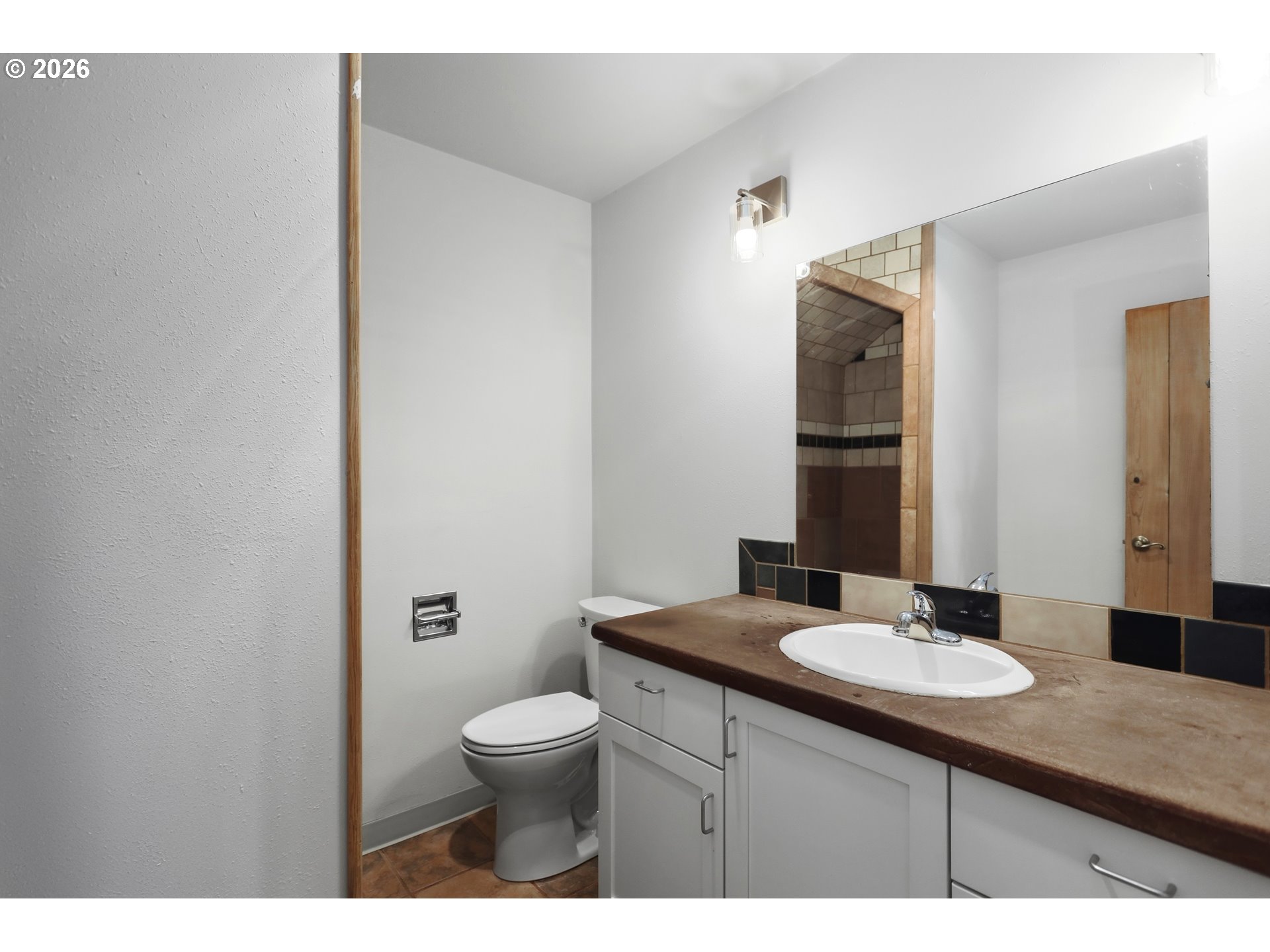 1707 Bridge Street The Dalles, OR 97058 - Photo 29 of 41 a bathroom with a sink a toilet a mirror and vanity
