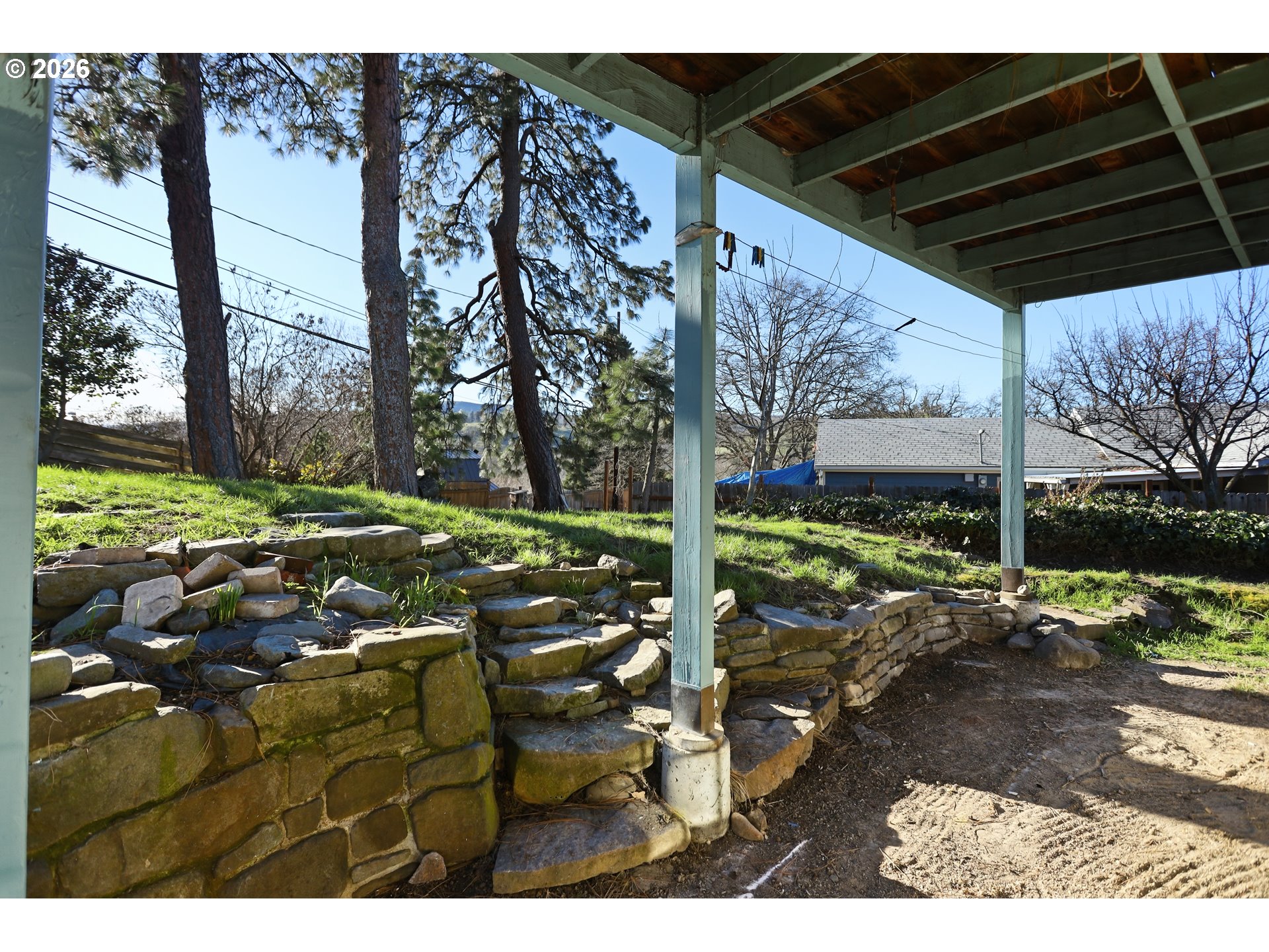 1707 Bridge Street The Dalles, OR 97058 - Photo 37 of 41 a backyard of a house with a garden and outdoor seating