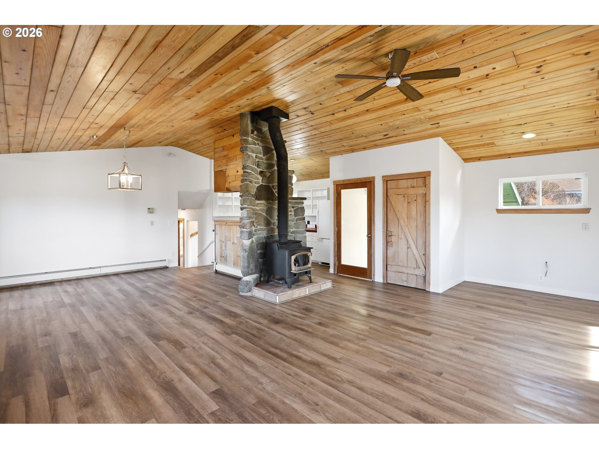 1707 Bridge Street The Dalles, OR 97058 - Photo 5 of 41 a view of empty room with wooden floor and fan