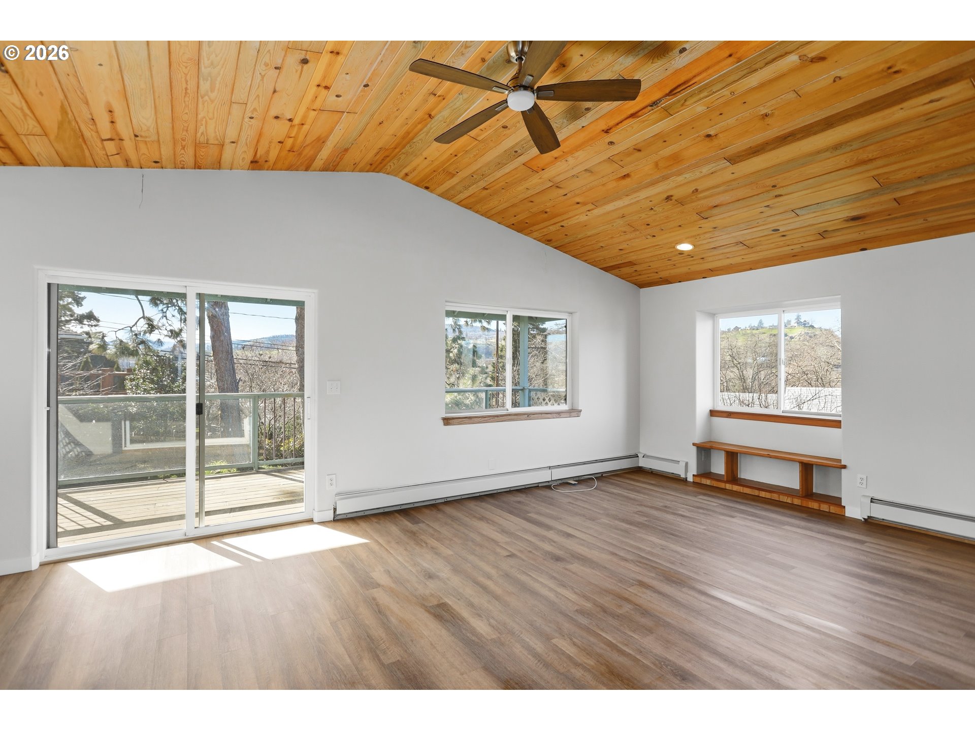 1707 Bridge Street The Dalles, OR 97058 - Photo 8 of 41 an empty room with wooden floor and windows