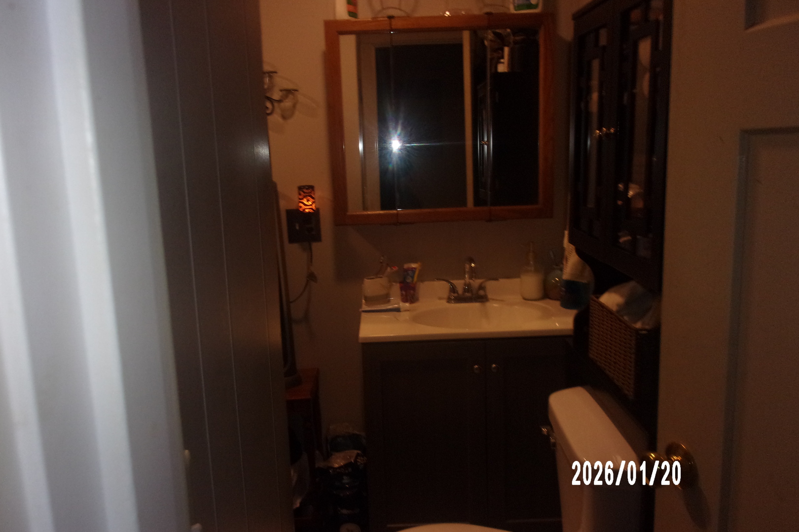 205 South Axtel Street Milford, IL 60953 - Photo 11 of 15 a bathroom with a sink a toilet and a mirror