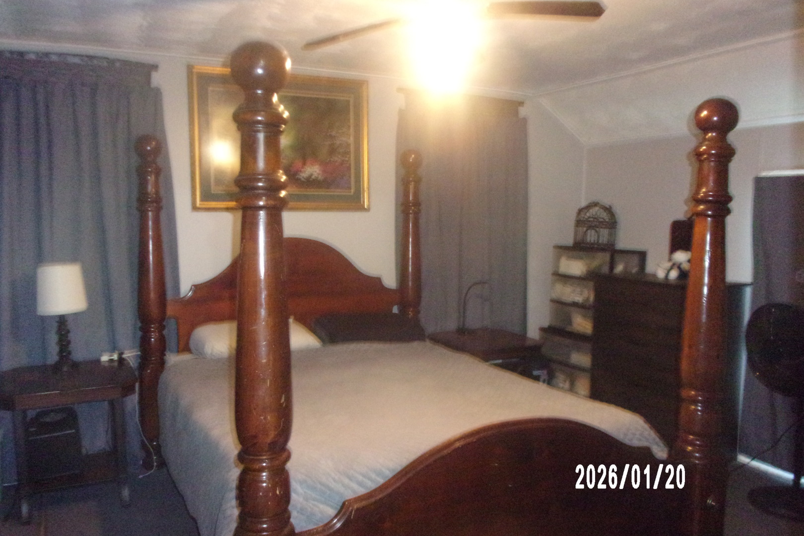 205 South Axtel Street Milford, IL 60953 - Photo 13 of 15 a bedroom with a bed and a lamp on dresser