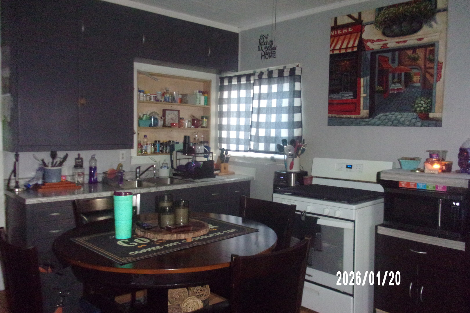 205 South Axtel Street Milford, IL 60953 - Photo 7 of 15 a kitchen with a appliances dining table and chairs