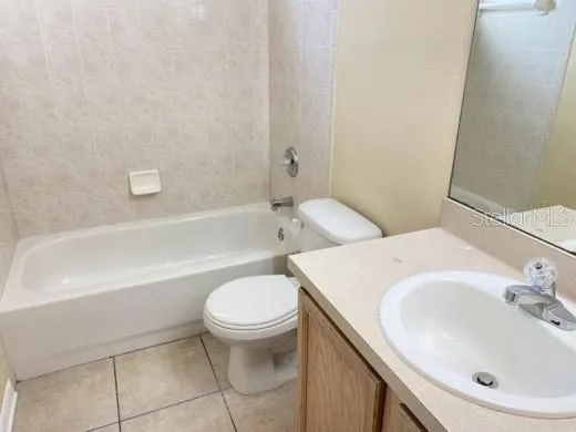 a bathroom with a sink a toilet and a bathtub