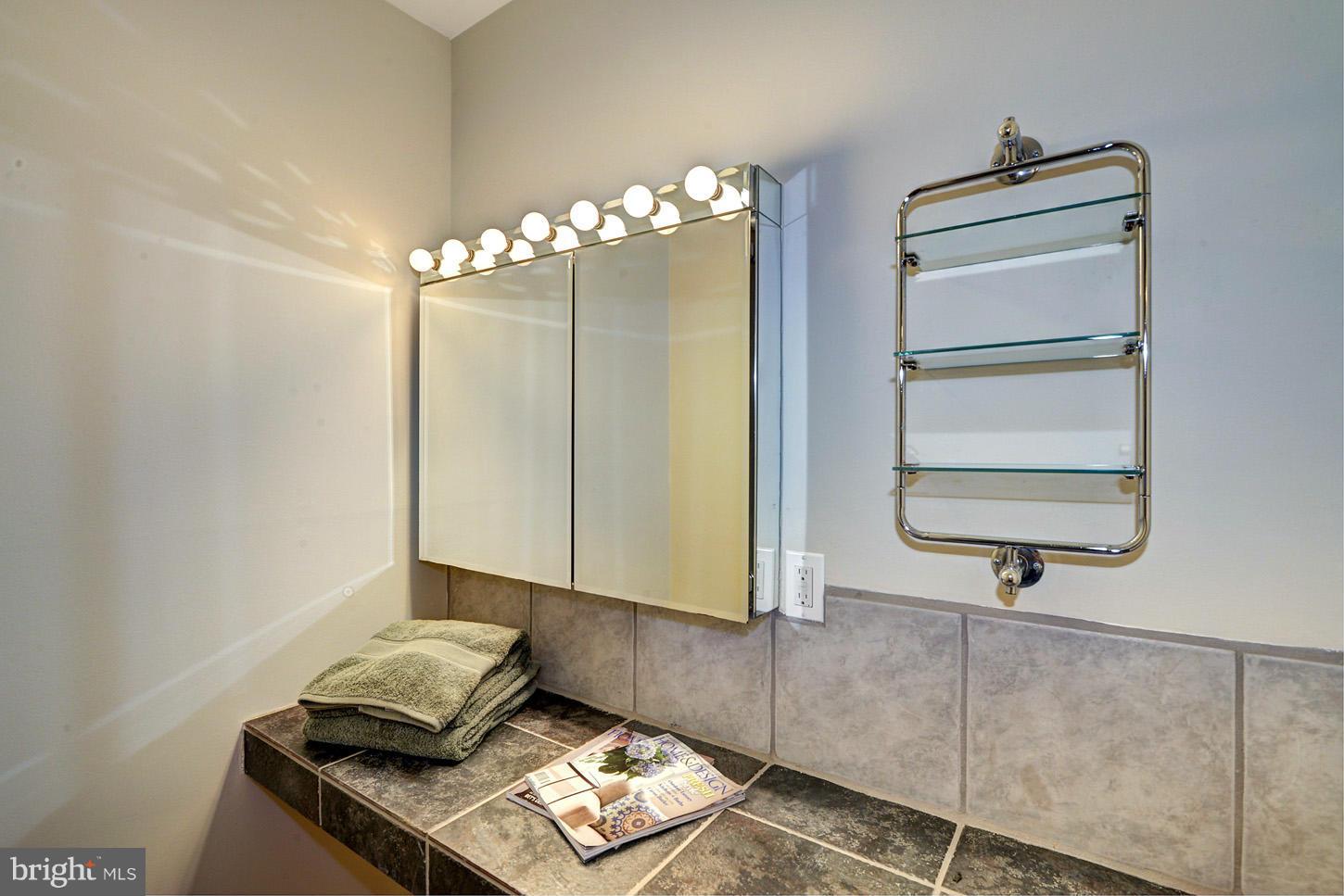 2701 Woodedge Road Silver Spring, MD 20906 - Photo 13 of 27 a bathroom with a light fixture and a sink