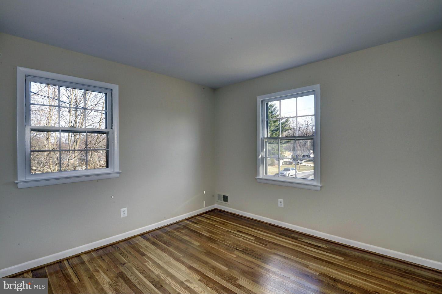 2701 Woodedge Road Silver Spring, MD 20906 - Photo 15 of 27 a view of an empty room with wooden floor and a window