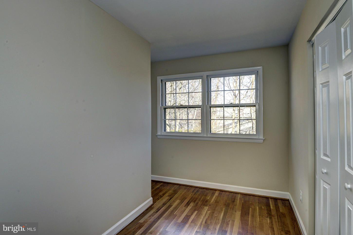 2701 Woodedge Road Silver Spring, MD 20906 - Photo 16 of 27 an empty room with wooden floor and windows