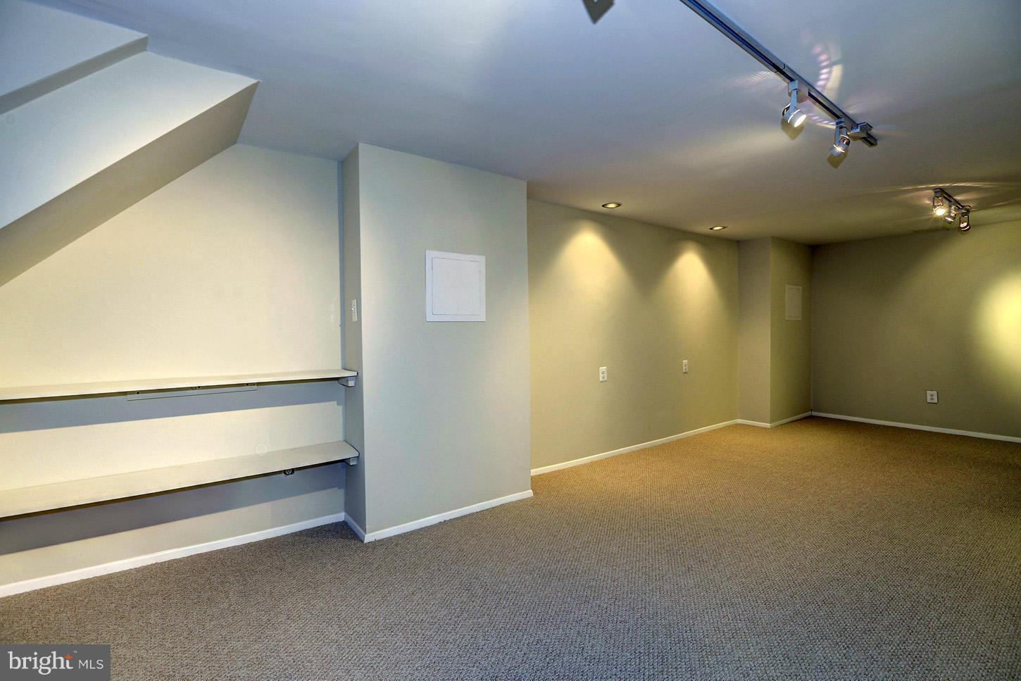 2701 Woodedge Road Silver Spring, MD 20906 - Photo 22 of 27 a view of an empty room with stairs