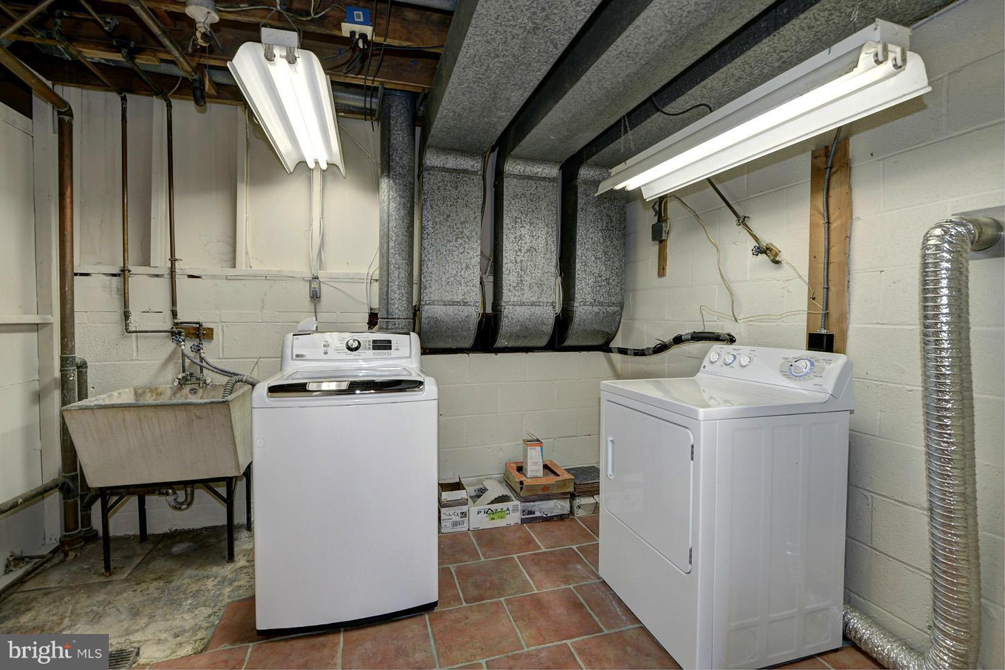 2701 Woodedge Road Silver Spring, MD 20906 - Photo 23 of 27 a utility room with dryer and washer