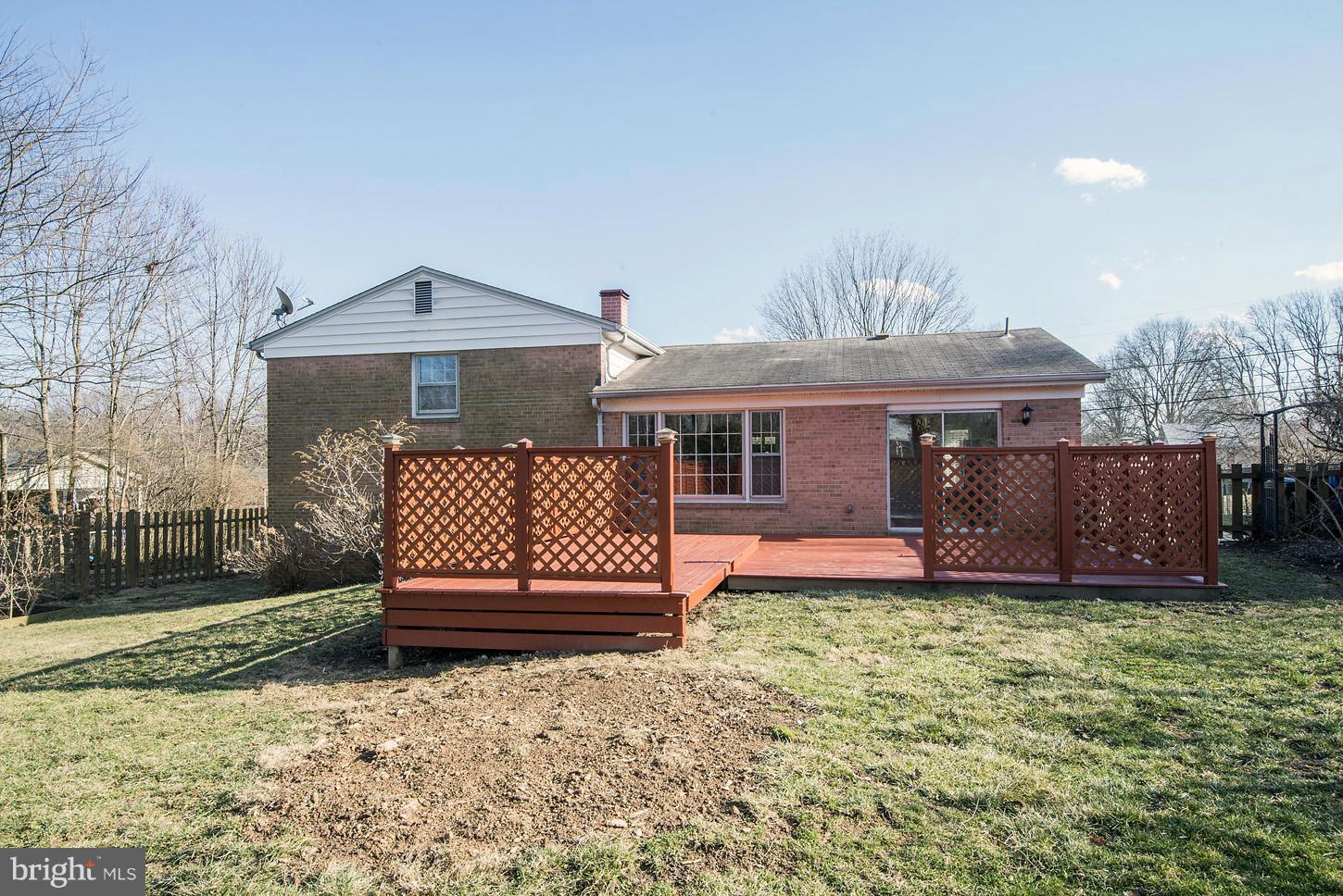 2701 Woodedge Road Silver Spring, MD 20906 - Photo 26 of 27 a front view of a house with a yard and garage