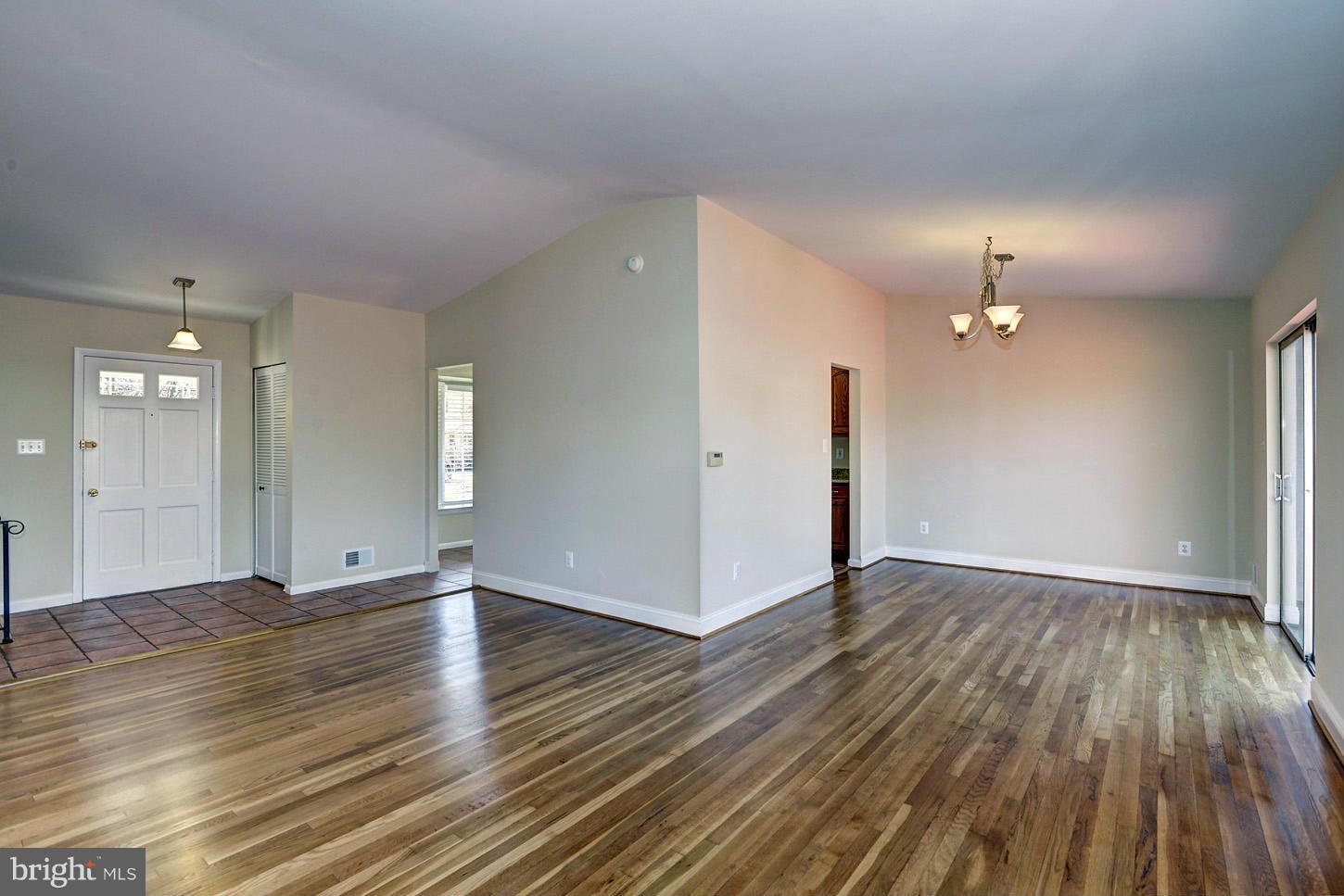 2701 Woodedge Road Silver Spring, MD 20906 - Photo 4 of 27 wooden floor in an empty room with a window