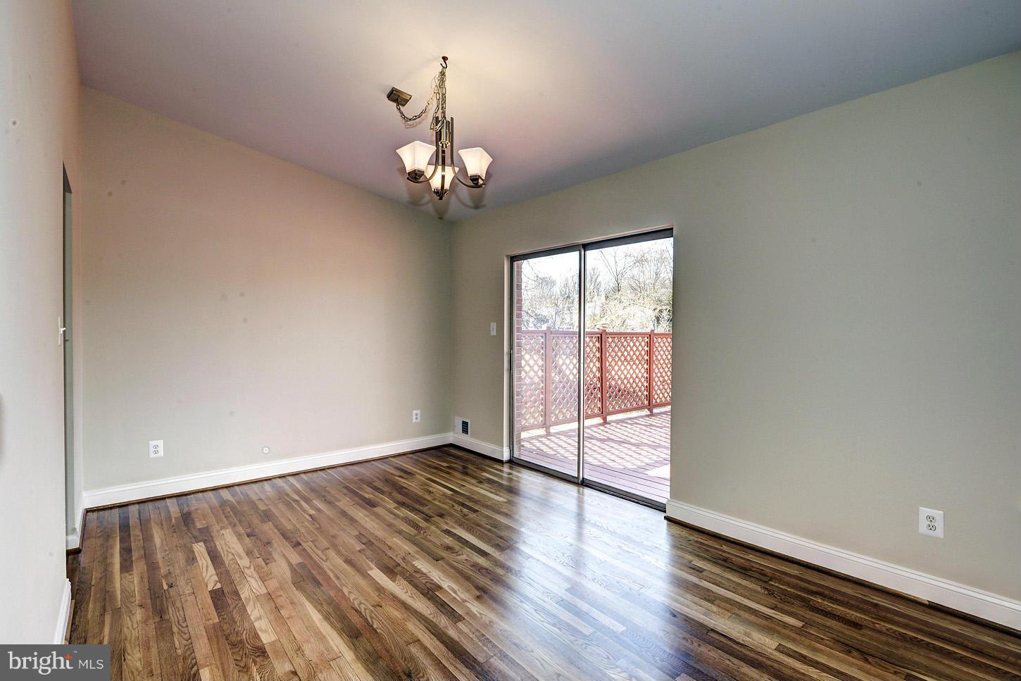 2701 Woodedge Road Silver Spring, MD 20906 - Photo 5 of 27 wooden floor in an empty room with a window