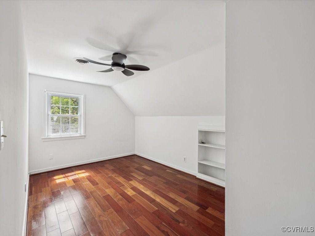 1407 Oldbury Road Midlothian, VA 23113 - Photo 19 of 34 an empty room with wooden floor chandelier fan and windows