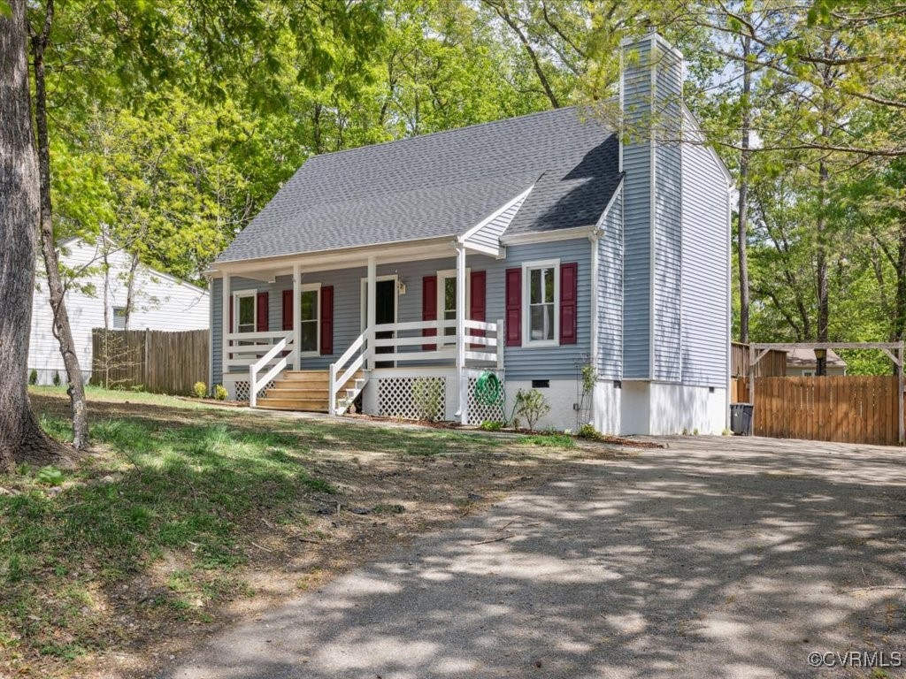 1407 Oldbury Road Midlothian, VA 23113 - Photo 2 of 34 a front view of a house with a yard garage and outdoor seating
