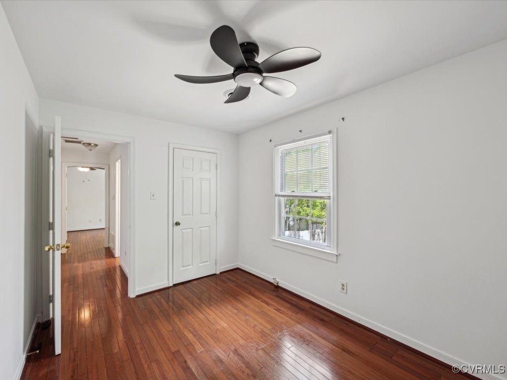 1407 Oldbury Road Midlothian, VA 23113 - Photo 21 of 34 a view of empty room with wooden floor and fan