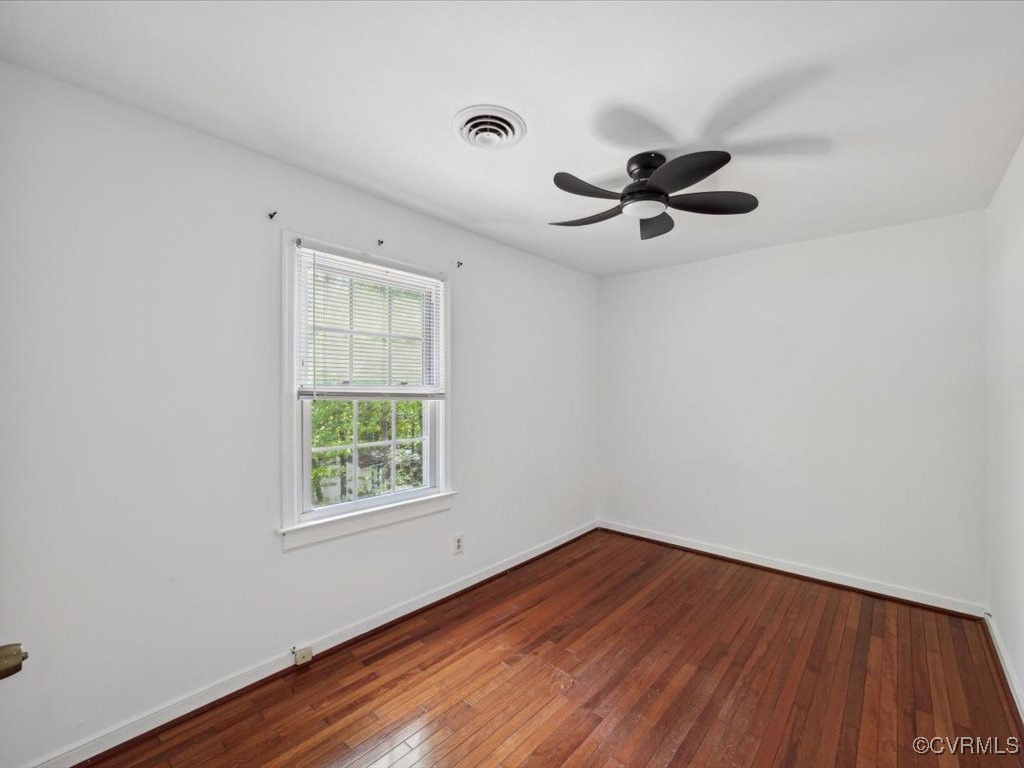 1407 Oldbury Road Midlothian, VA 23113 - Photo 22 of 34 wooden floor in an empty room with a window