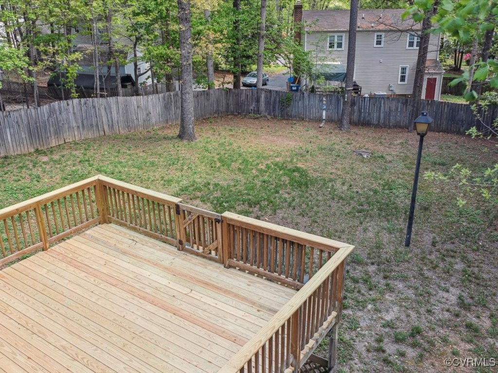 1407 Oldbury Road Midlothian, VA 23113 - Photo 26 of 34 a view of deck with wooden fence and trees