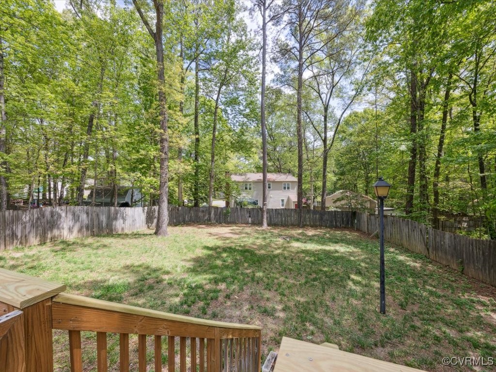 1407 Oldbury Road Midlothian, VA 23113 - Photo 30 of 34 a view of a backyard with trees