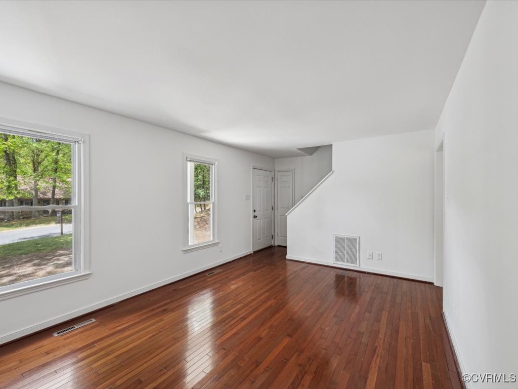 1407 Oldbury Road Midlothian, VA 23113 - Photo 7 of 34 an empty room with wooden floor and windows