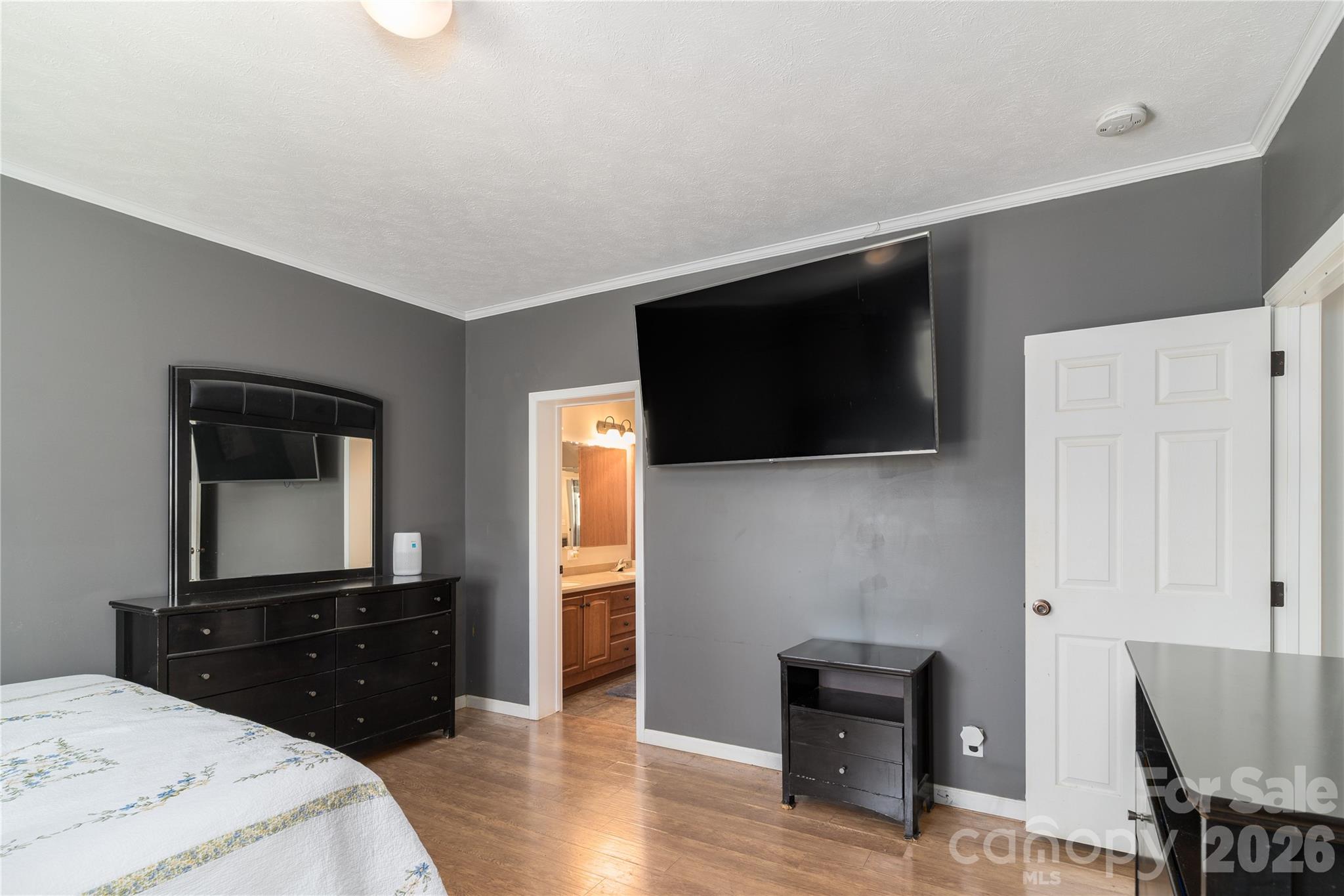 296 Stillwater Road Troutman, NC 28166 - Photo 25 of 33 a bedroom with a bed and a television