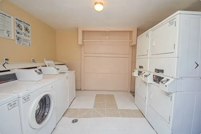 a view of storage and utility room with washer and dryer
