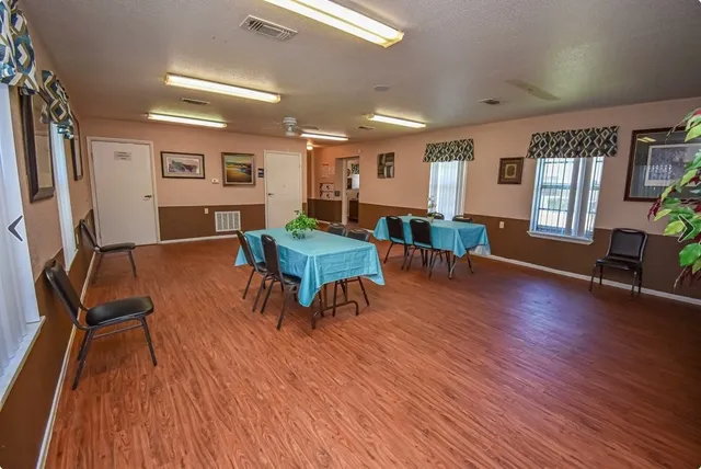 a view of a livingroom with furniture window and wooden floor