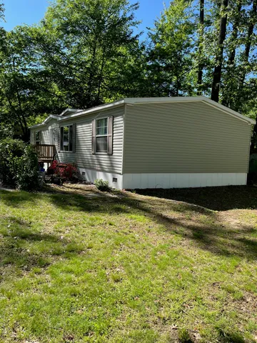 a view of house with swimming pool