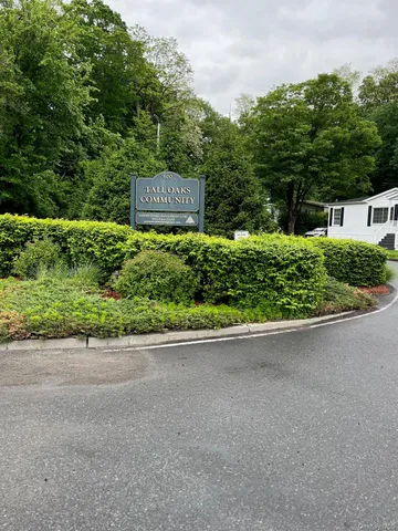a view of a street with a sign board