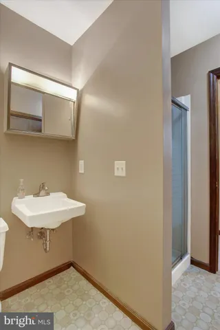 a bathroom with a sink a mirror and vanity