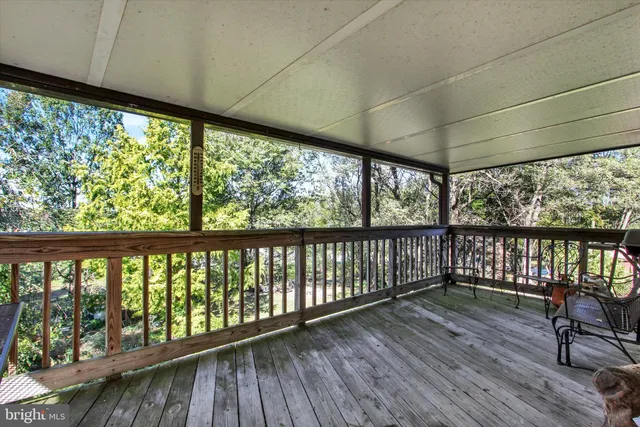 a view of two chairs in a balcony