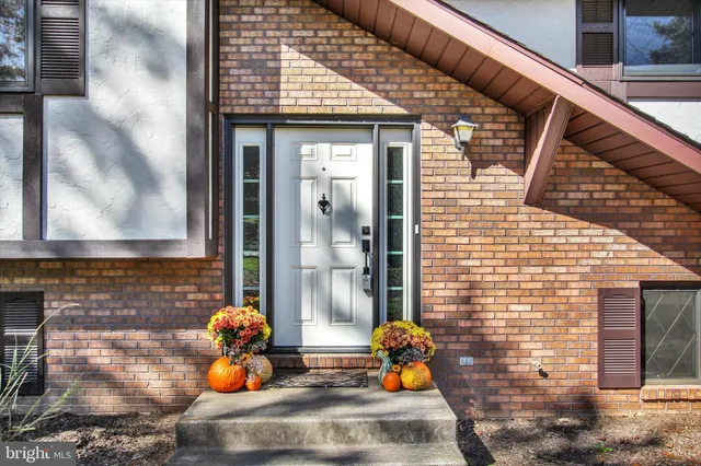 a front view of a house with outdoor seating