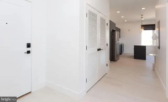 a view of a hallway with closet