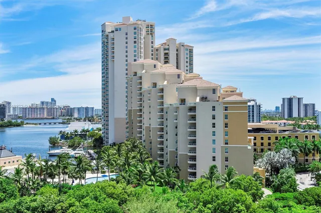 a bedroom with a bed and painting on the wall
