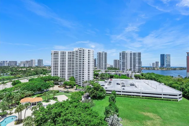 a view of a swimming pool with outdoor seating