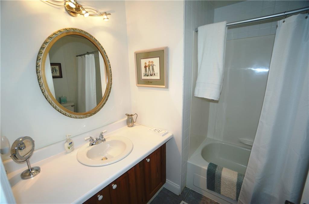 343 Green Valley Road Eighty Four, PA 15330 - Photo 22 of 25 Family bathroom has extra large vanity has been updated w ceramic flooring, high out put lighting, one piece shower/tub and features a laundry shoot!