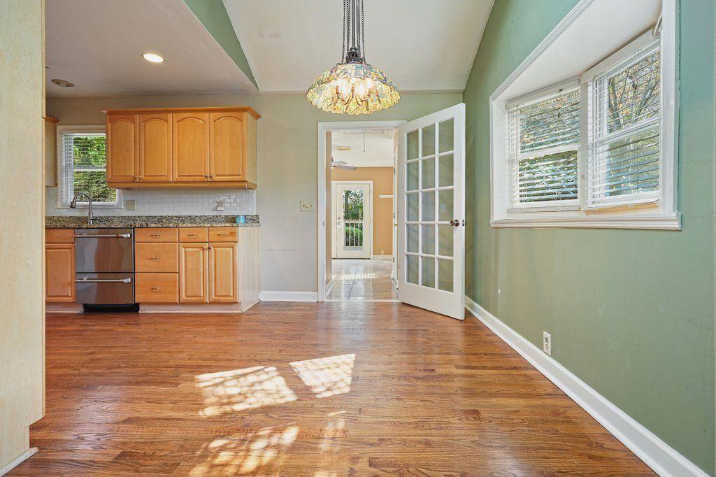 3799 Oglesby Road Powder Springs, GA 30127 - Photo 11 of 39 a view of a kitchen with a stove cabinets and wooden floor