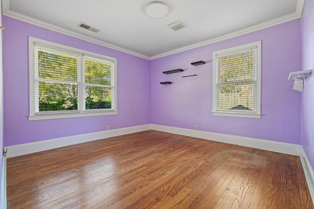 3799 Oglesby Road Powder Springs, GA 30127 - Photo 25 of 39 a view of an empty room with a window and wooden floor