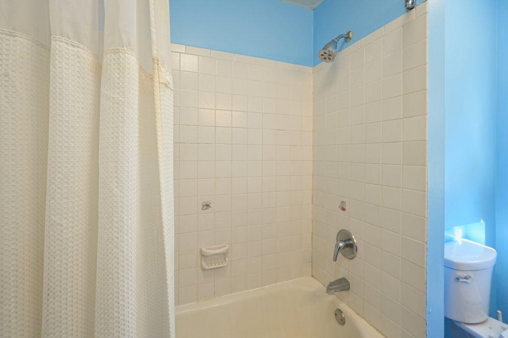 3799 Oglesby Road Powder Springs, GA 30127 - Photo 35 of 39 a bathroom with a bathtub and a toilet
