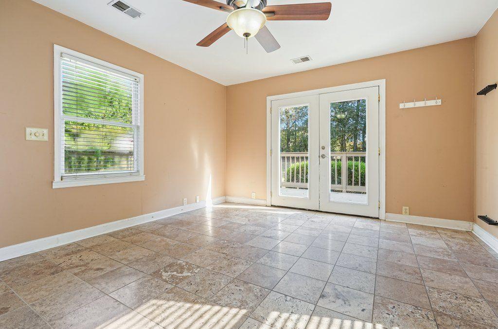 3799 Oglesby Road Powder Springs, GA 30127 - Photo 6 of 39 a view of an empty room with window and chandelier fan