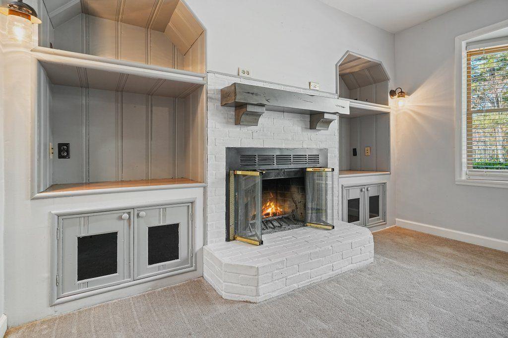 3799 Oglesby Road Powder Springs, GA 30127 - Photo 8 of 39 a living room with furniture and a fireplace