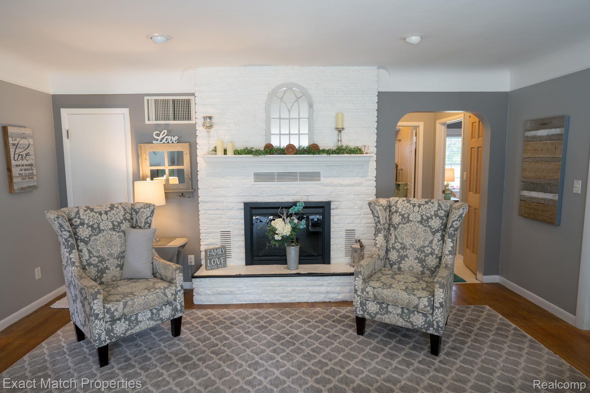 3916 Gregory Road Lake Orion, MI 48359 - Photo 9 of 36 Natural wood Fireplace with mantel...