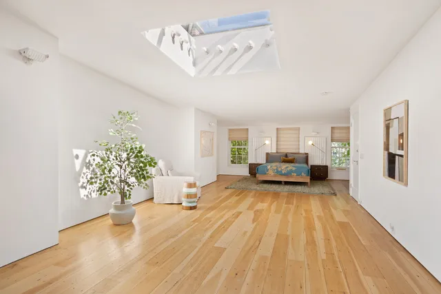 a view of a livingroom with furniture and wooden floor