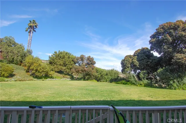 a view of a yard and ocean view