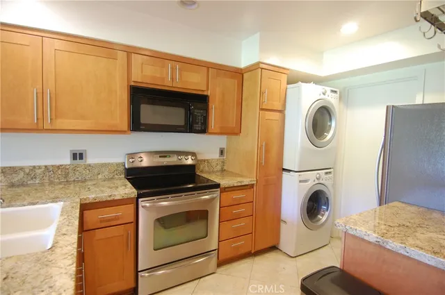 a kitchen with a stove a washer and dryer