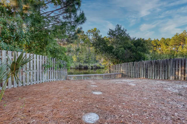 a view of outdoor space with wooden fence