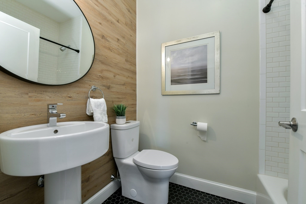 884 Adams Street, Unit 3 Boston, MA 02124 - Photo 17 of 24 a bathroom with a sink and mirror
